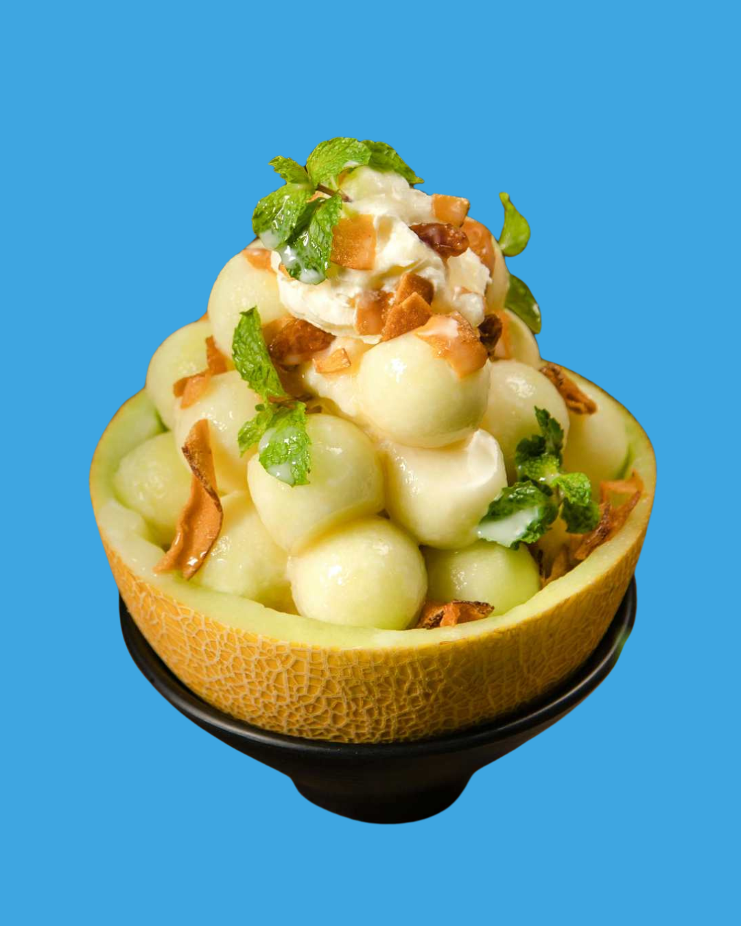 Bowl de melón Lililup con helado de coco, coco tostado y hierbabuena